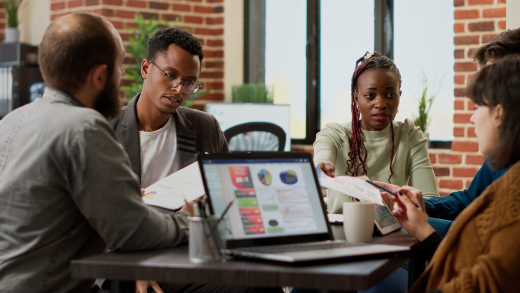 Diverse team of coworkers analyzing research information