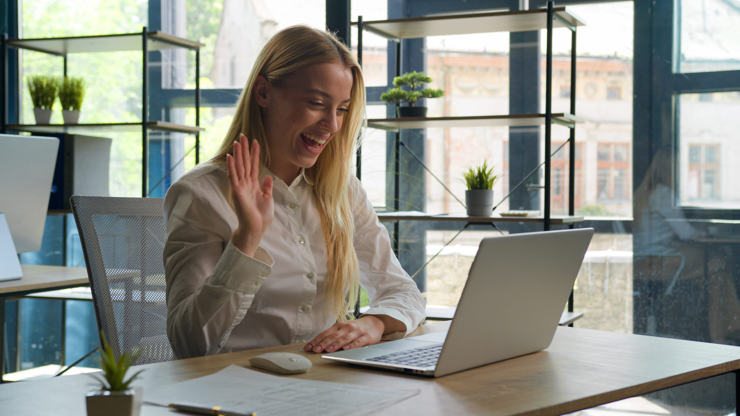 Smiling woman on a video call on a laptop